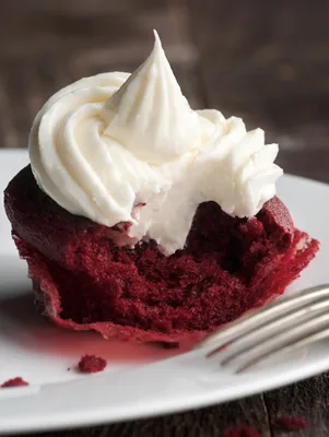 Paula Deen Bobby’s red velvet cupcakes with orange cream cheese frosting topped with pecans and coconut