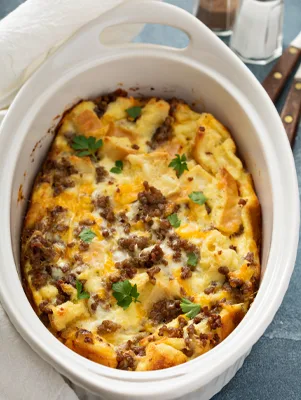 Paula Deen Breakfast Bake with Italian turkey sausage and Gruyere cheese in a baking dish