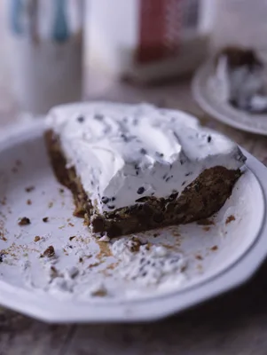 Paula Deen Chocolate Chip Pie with golden cookie crust topped with chocolate chip whipped cream