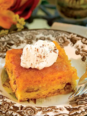 Paula Deen Creamy Pumpkin Squares sliced into bars with a pecan cake mix crust and pumpkin cream cheese filling