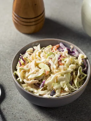 Paula Deen Easy Coleslaw in a large bowl with shredded cabbage and scallions