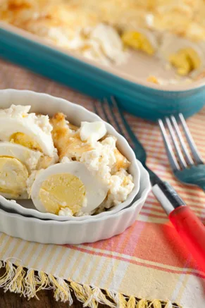 Paula Deen egg casserole with hard-boiled eggs in a golden Gruyere and Parmesan cream sauce