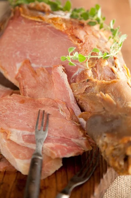 Paula Deen Fresh Ham roasted with soy sauce and House Seasoning, showing a dark seasoned crust on a whole pork leg