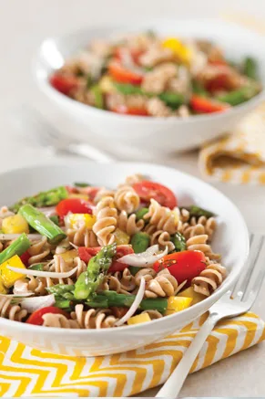 Paula Deen garden pasta salad with whole wheat spirals, asparagus, cherry tomatoes, and yellow bell pepper in a sherry vinegar dressing