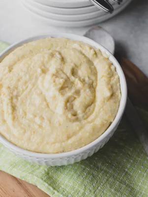 A bowl of creamy Paula Deen grits made with milk and butter
