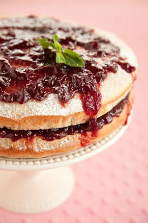 Paula Deen Jam Cake with raspberry jam layered between two spiced buttermilk cake rounds