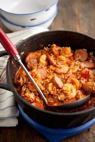 A bowl of Paula Deen Jambalaya with smoked sausage, shrimp, rice, and tomatoes