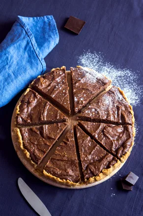 Old-fashioned fudge pie with a dense chocolate filling in a golden pie crust