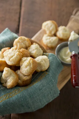 Paula Deen sour cream butter biscuits golden brown in a miniature muffin pan