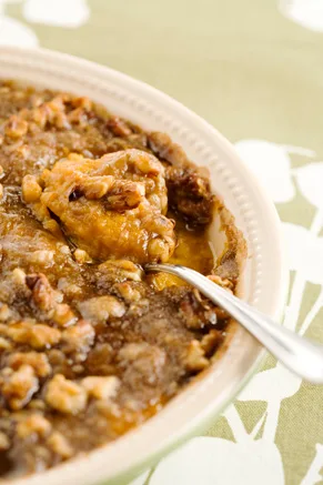 Paula Deen sweet potato bake in a casserole dish topped with a brown sugar pecan crumble