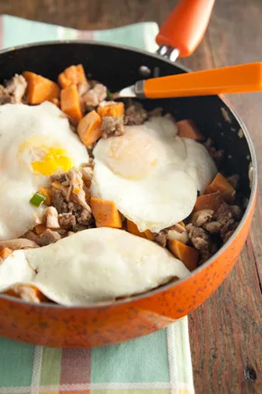 Paula Deen Turkey Hash in a cast iron skillet with sweet potato and sausage
