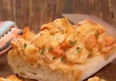 Paula Deen crawfish bread with melted cheese and crawfish on toasted French bread slices