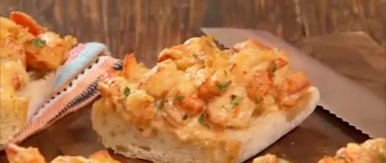 Paula Deen crawfish bread with melted cheese and crawfish on toasted French bread slices