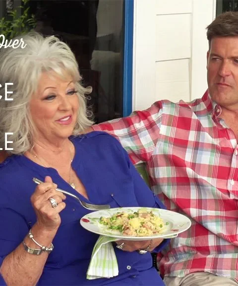 Paula Deen ham fried rice with pineapple served on a white plate with a fork