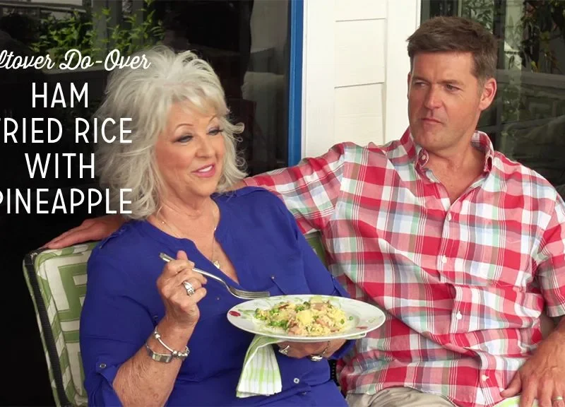 Paula Deen ham fried rice with pineapple served on a white plate with a fork