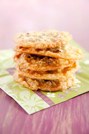 Stack of Paula Deen oatmeal chocolate chip cookies with crisp golden edges on a green floral napkin