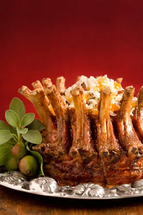 Paula Deen pork crown roast with stuffing of rice, prunes and apricots on a silver platter
